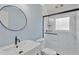 This bathroom has modern fixtures including a glass enclosed shower and updated vanity at 37451 Hickory Hill Ln, Dade City, FL 33525