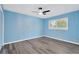 This light blue bedroom offers ample space and light, creating a calming and inviting atmosphere at 37451 Hickory Hill Ln, Dade City, FL 33525