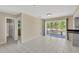Bright dining area with tiled floors and sliding glass doors that provide access to an outdoor deck at 37451 Hickory Hill Ln, Dade City, FL 33525