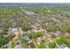 Aerial view of a neighborhood featuring well-maintained homes, mature landscaping, and shady tree cover at 3952 Applegate Cir, Brandon, FL 33511