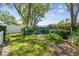 Serene backyard showcasing mature trees, vibrant greenery, and a well-manicured lawn, providing a peaceful outdoor oasis at 3952 Applegate Cir, Brandon, FL 33511
