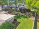 Well-maintained backyard with lush green grass, mature trees, and meticulously kept landscaping at 3952 Applegate Cir, Brandon, FL 33511