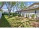 Spacious backyard featuring a well-maintained lawn, mature trees, and lush landscaping, providing a private outdoor retreat at 3952 Applegate Cir, Brandon, FL 33511