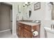 Bathroom showcasing granite countertop, decorative mirror, and ample cabinet space at 3952 Applegate Cir, Brandon, FL 33511