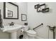 Bathroom with pedestal sink, framed mirror, and accessible features at 3952 Applegate Cir, Brandon, FL 33511
