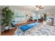Bright bedroom featuring a mirrored closet, indoor plants, and large windows with shutter-style blinds at 3952 Applegate Cir, Brandon, FL 33511