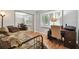 Bedroom featuring a twin bed, a desk, chair, and natural light from the window at 3952 Applegate Cir, Brandon, FL 33511