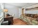Bedroom featuring a day bed, a desk, chair, with a large art piece on the wall at 3952 Applegate Cir, Brandon, FL 33511