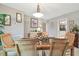 Formal dining room with neutral tones, a glass dining table, and elegant decor at 3952 Applegate Cir, Brandon, FL 33511