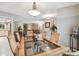 Elegant dining room with a glass-top table, seating for six, and view to living room at 3952 Applegate Cir, Brandon, FL 33511