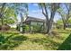 Charming home featuring a well-manicured lawn, mature trees, and attractive landscaping, enhancing its curb appeal at 3952 Applegate Cir, Brandon, FL 33511