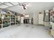 Spacious garage equipped with laundry facilities and ample storage shelving for organization and convenience at 3952 Applegate Cir, Brandon, FL 33511
