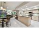 Spacious kitchen with an island, adjacent to a living room and dining area at 3952 Applegate Cir, Brandon, FL 33511