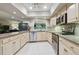 Bright kitchen featuring granite countertops, modern appliances, and open layout to the living area at 3952 Applegate Cir, Brandon, FL 33511