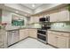 Bright kitchen features granite countertops, tiled backsplash, stainless steel appliances, and plenty of cabinet space at 3952 Applegate Cir, Brandon, FL 33511