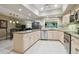 Bright kitchen featuring granite countertops, modern appliances, and an open view to the living room at 3952 Applegate Cir, Brandon, FL 33511