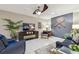 Stylish living room with comfortable seating, modern decor, and a ceiling fan for added comfort at 3952 Applegate Cir, Brandon, FL 33511