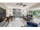 Inviting living room with comfortable seating, ceiling fan, and stylish decor accents at 3952 Applegate Cir, Brandon, FL 33511