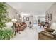 Bright living room featuring neutral paint, white carpet, and stylish furnishings at 3952 Applegate Cir, Brandon, FL 33511