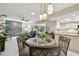 Open-concept living space with dining area and kitchen featuring updated appliances at 3952 Applegate Cir, Brandon, FL 33511