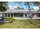 Spacious backyard with a screened lanai and stone patio area perfect for entertaining at 39650 Us Highway 19 N # 615, Tarpon Springs, FL 34689