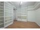 Bedroom with built in shelving, wood floors and a bright, fresh feel at 39650 Us Highway 19 N # 615, Tarpon Springs, FL 34689