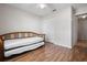 Comfortable bedroom featuring laminate wood floors and a daybed at 39650 Us Highway 19 N # 615, Tarpon Springs, FL 34689