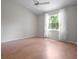 Bright bedroom with a ceiling fan, natural light, and wood flooring at 39650 Us Highway 19 N # 615, Tarpon Springs, FL 34689