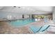 Relaxing indoor community pool area with comfortable seating and easy access, a great amenity at 39650 Us Highway 19 N # 615, Tarpon Springs, FL 34689