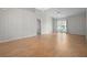 Bright living room with wood floors, a chandelier and ceiling fan, and sliding doors to the patio at 39650 Us Highway 19 N # 615, Tarpon Springs, FL 34689