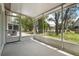 Screened in patio looking out onto a lush back yard at 39650 Us Highway 19 N # 615, Tarpon Springs, FL 34689