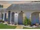 Charming condo features a light exterior, arched entryways, and manicured landscaping at 4229 Redcliff Pl, New Port Richey, FL 34652