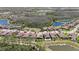 An aerial showcases properties with pools in a lovely community surrounded by greenery at 4782 Night Star Trl, Odessa, FL 33556