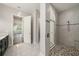 Modern bathroom featuring a walk-in shower with stone floors and tiled walls at 4782 Night Star Trl, Odessa, FL 33556
