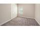 Bedroom with a window, a closet, and neutral-toned walls and carpeting at 4782 Night Star Trl, Odessa, FL 33556