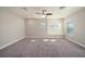 Spacious bonus room with carpeting, a ceiling fan, and many windows for natural light at 4782 Night Star Trl, Odessa, FL 33556