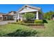 Lovely home with a well-manicured lawn, elegant landscaping, and a side-entry three car garage at 4782 Night Star Trl, Odessa, FL 33556