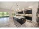 Modern kitchen with stainless steel appliances, a large island, and sliding glass doors to the outdoor space at 4782 Night Star Trl, Odessa, FL 33556