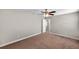 Bedroom featuring plush carpet, a ceiling fan, and a closet with a white paneled door at 5159 Sterling Manor Dr, Tampa, FL 33647