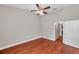 Bedroom featuring wood-look flooring, neutral paint, and a closet at 5159 Sterling Manor Dr, Tampa, FL 33647