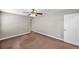 Bedroom featuring plush carpet, a ceiling fan, and a closet with a white paneled door at 5159 Sterling Manor Dr, Tampa, FL 33647