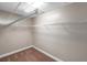 Walk-in closet with wire shelving, neutral carpet, and neutral painted walls at 5159 Sterling Manor Dr, Tampa, FL 33647