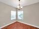 Bright dining room with a chandelier and natural light from the windows at 5159 Sterling Manor Dr, Tampa, FL 33647