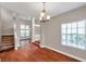 Dining room with staircase, chandelier, transom windows, and natural light at 5159 Sterling Manor Dr, Tampa, FL 33647