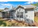 Rear exterior showcasing the screened-in porch and light gray siding at 5159 Sterling Manor Dr, Tampa, FL 33647