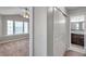 View into bedroom and bathroom featuring a closet and bathroom with modern finishes and fixtures at 5159 Sterling Manor Dr, Tampa, FL 33647