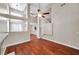 Spacious living room with wood floors, vaulted ceilings, and open layout, creating a modern feel at 5159 Sterling Manor Dr, Tampa, FL 33647