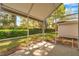 Screened patio with view to lush backyard landscaping at 5159 Sterling Manor Dr, Tampa, FL 33647
