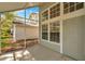 Screened porch with view of the well-maintained yard at 5159 Sterling Manor Dr, Tampa, FL 33647