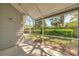 Screened lanai offering peaceful views of the backyard at 5159 Sterling Manor Dr, Tampa, FL 33647